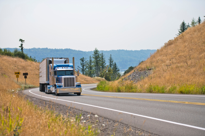 Owner - operators are the main core of the drivers of classic big rig semi trucks engaged in the transport of perishable goods in refrigerated trailers delivering goods in time to their places of use