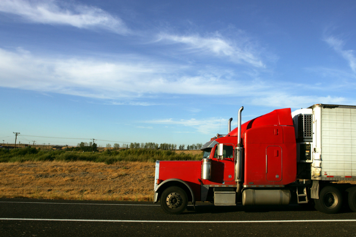 Semi truck going fast on interstate highway