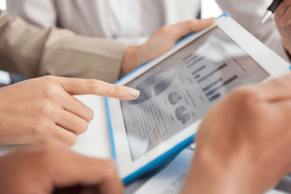 A professional analyst reviews commercial vehicle accident statistics using digital charts and U.S. crash data in a modern office setting.