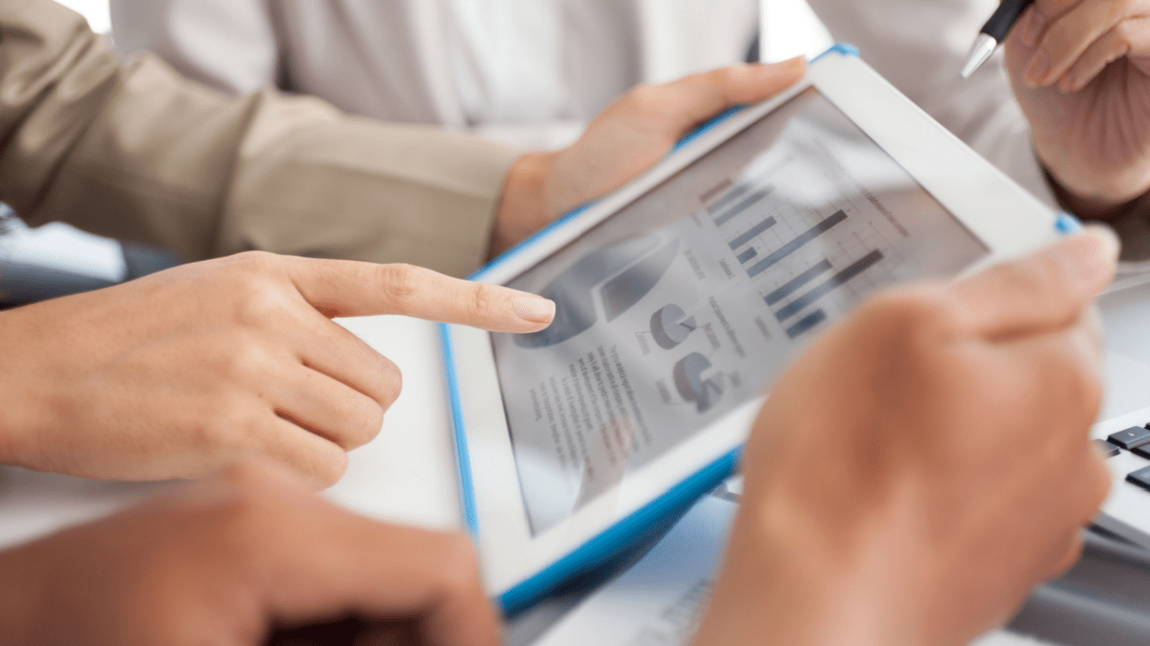 A professional analyst reviews commercial vehicle accident statistics using digital charts and U.S. crash data in a modern office setting.