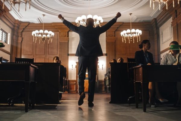 Lawyer celebrating courtroom victory after winning case