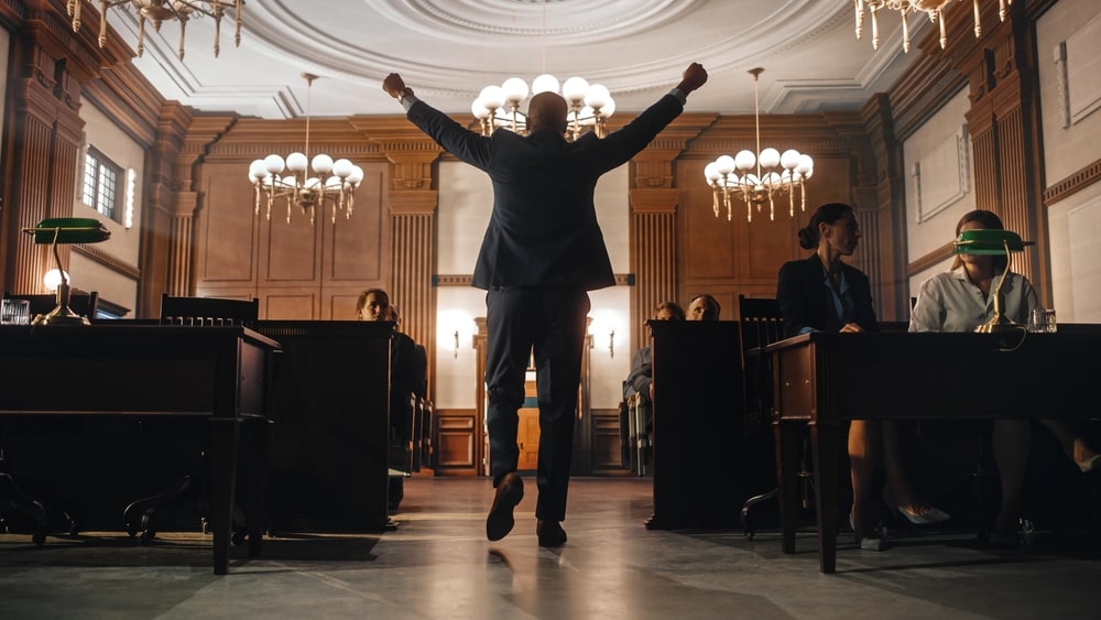 Lawyer celebrating courtroom victory after winning case
