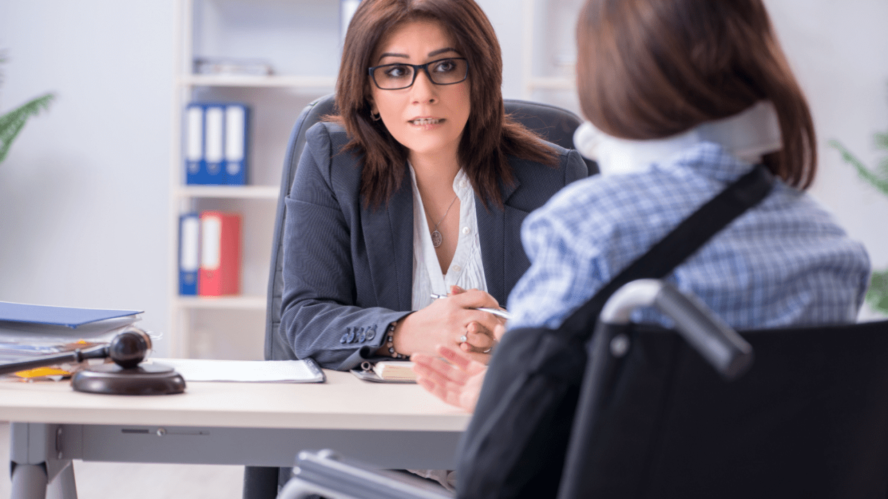 Female attorney consulting client about how long does it take to clear a semi accident legal implications
