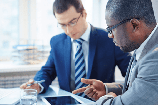 Two professional lawyers discussing how do you bring a claim in negligence during legal consultation