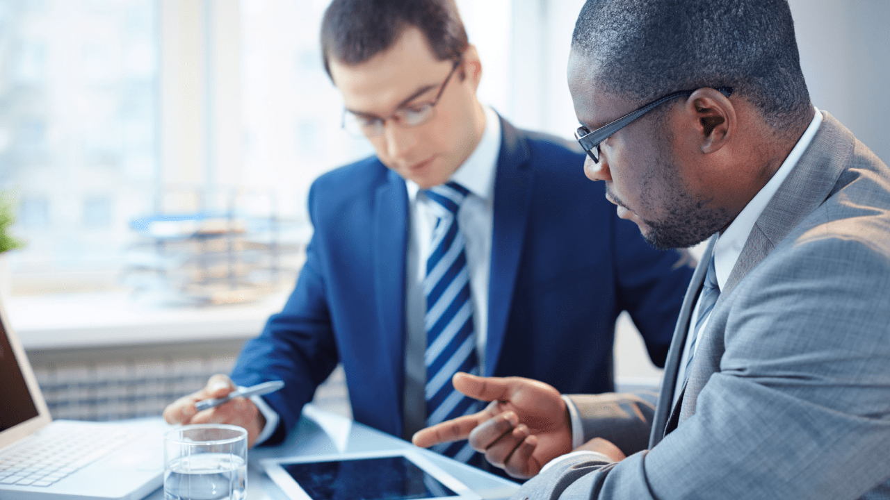 Two professional lawyers discussing how do you bring a claim in negligence during legal consultation