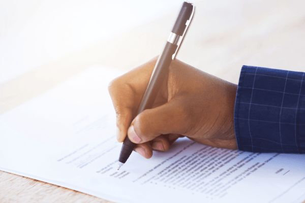 Client signing legal documents wondering can I sue my lawyer for pain and suffering after malpractice