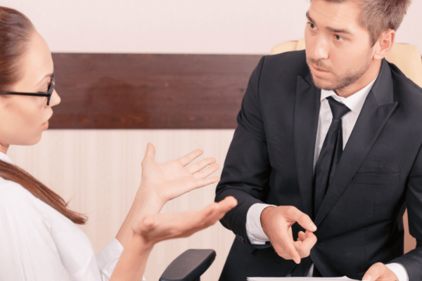 Professional lawyer negotiating with insurance adjuster demonstrating can a lawyer negotiate with insurance adjusters in office setting