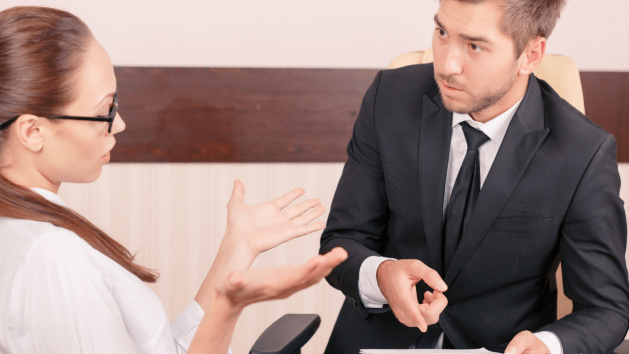 Professional lawyer negotiating with insurance adjuster demonstrating can a lawyer negotiate with insurance adjusters in office setting