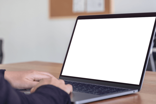 Client using laptop researching how often should you expect to hear from a lawyer in a personal injury case