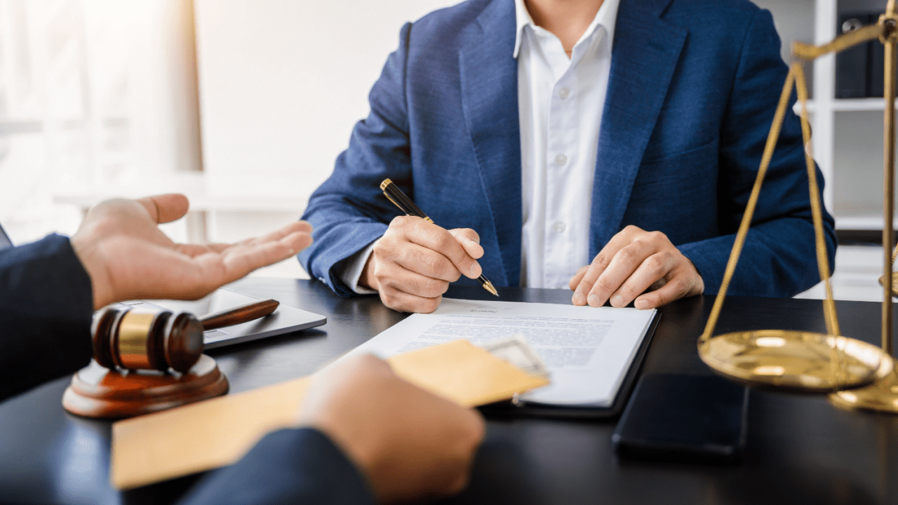 Attorney discussing common settlement ranges for truck accidents with client during legal consultation