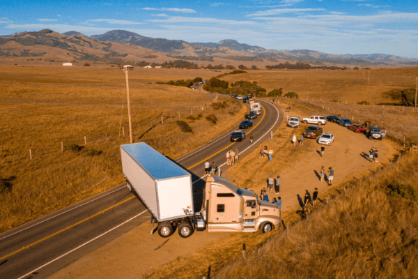 18-wheeler truck accident scene showing what happens when an 18-wheeler hits you with emergency responders and traffic backup