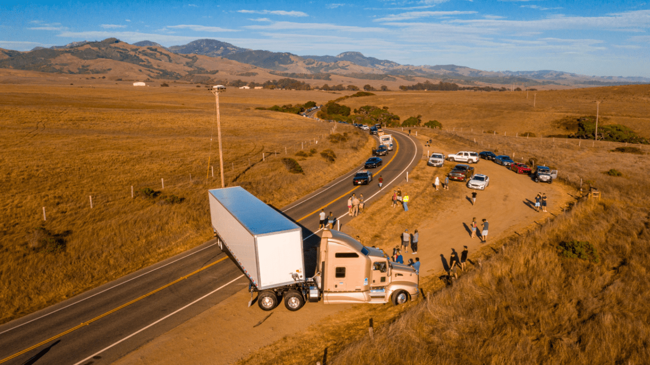 18-wheeler truck accident scene showing what happens when an 18-wheeler hits you with emergency responders and traffic backup