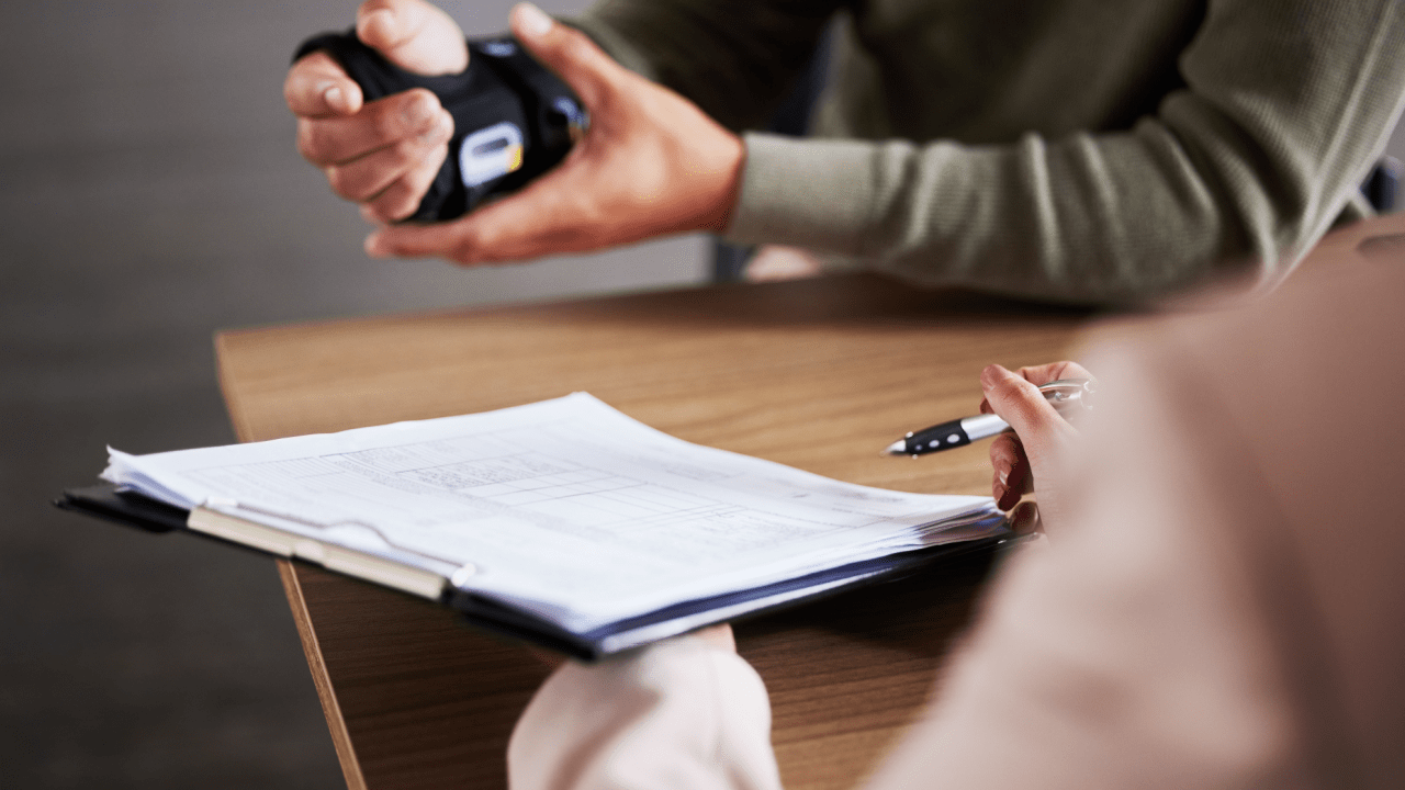 What should I expect from my personal injury lawyer consultation - client and attorney reviewing legal documents and case materials