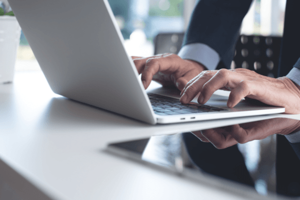 Professional attorney researching do truck accident lawyers go to trial often while working on laptop in modern office