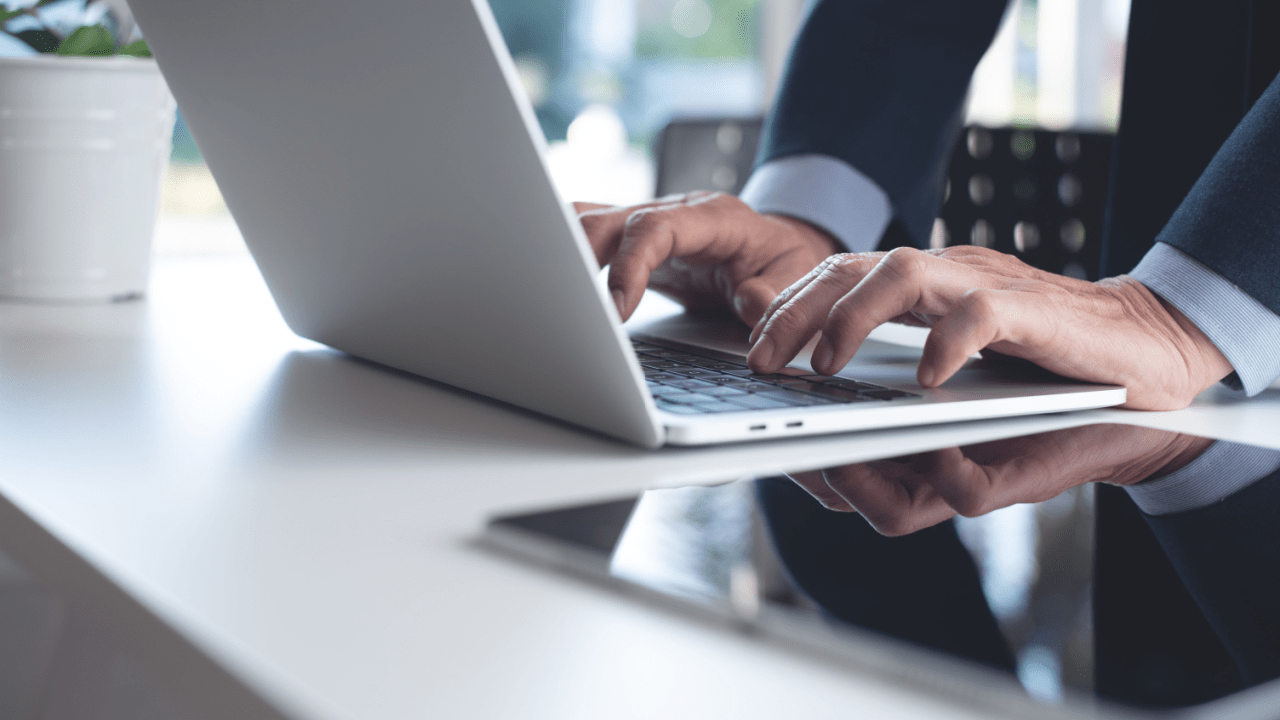 Professional attorney researching do truck accident lawyers go to trial often while working on laptop in modern office