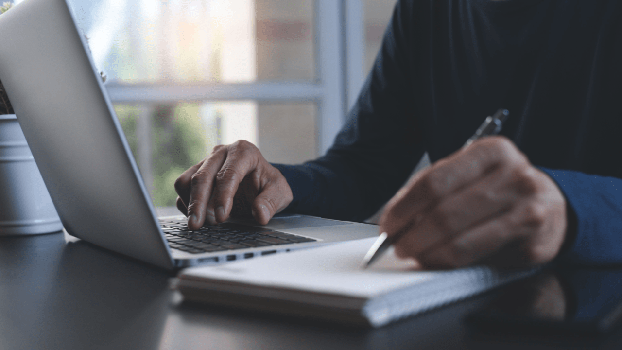 Professional reviewing truck accident settlement documents on laptop - is 25000 a good settlement for a truck accident