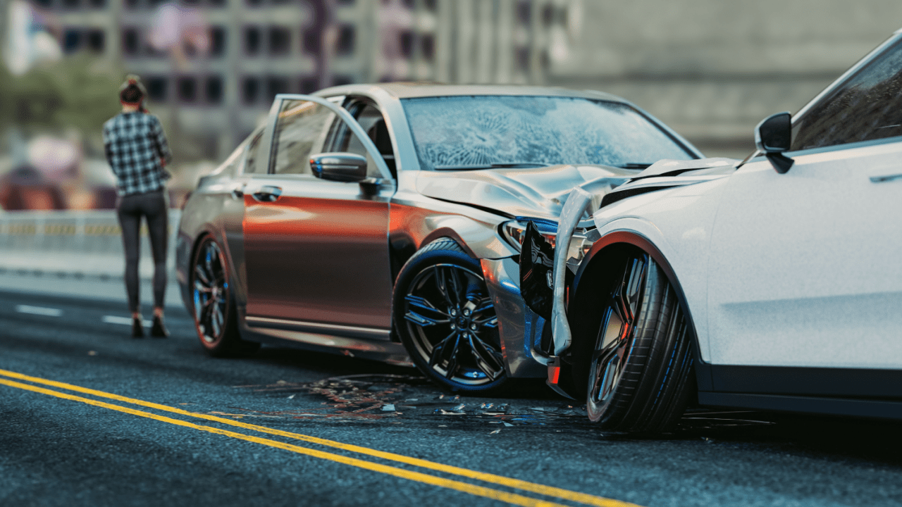 Car accident scene showing damaged vehicles requiring knowledge of how to negotiate a car accident injury settlement