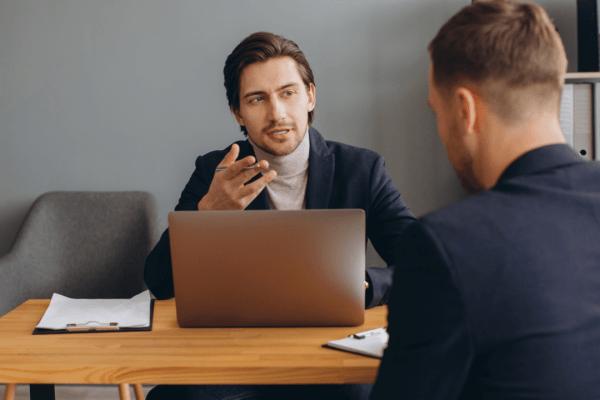 Attorney advising client on should you sue after a truck accident during professional legal consultation