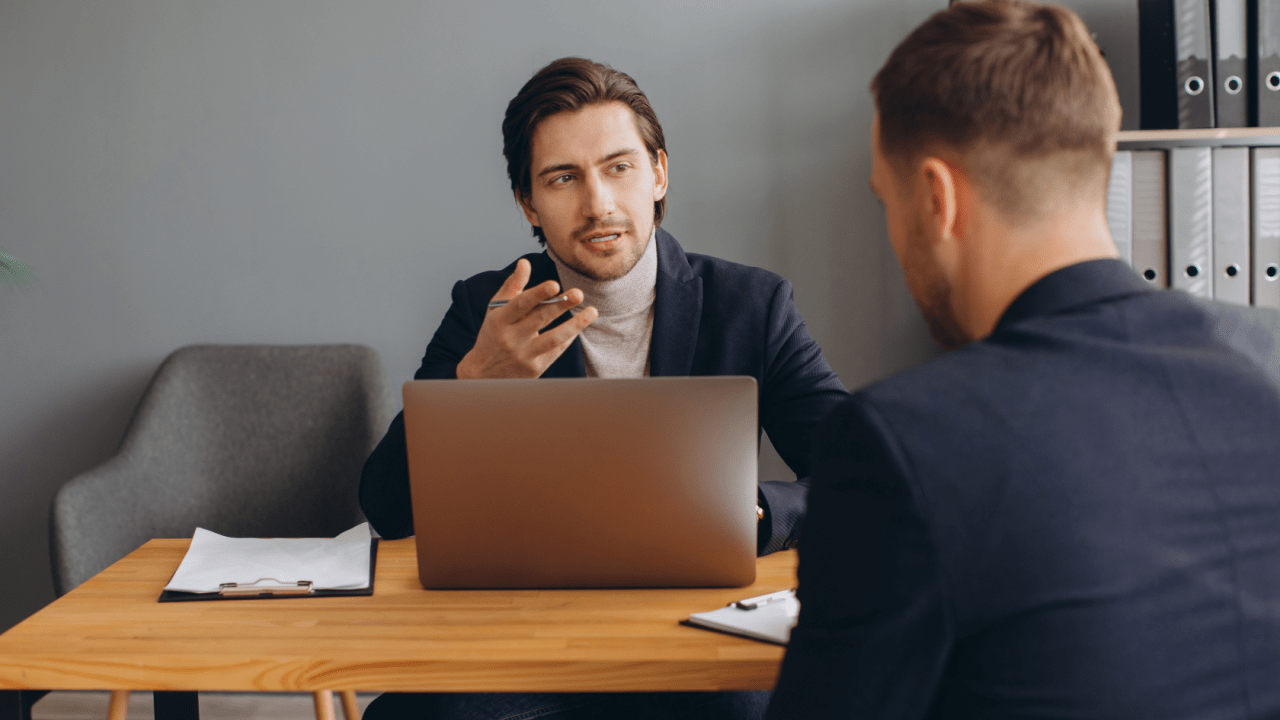 Attorney advising client on should you sue after a truck accident during professional legal consultation