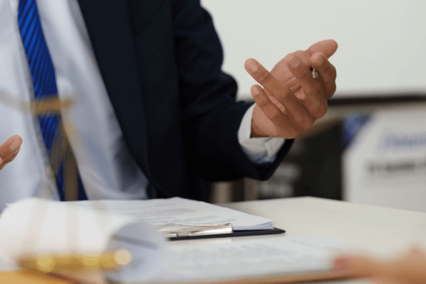 Professional truck crash lawyer consultation with client discussing legal documents and case strategy in law office