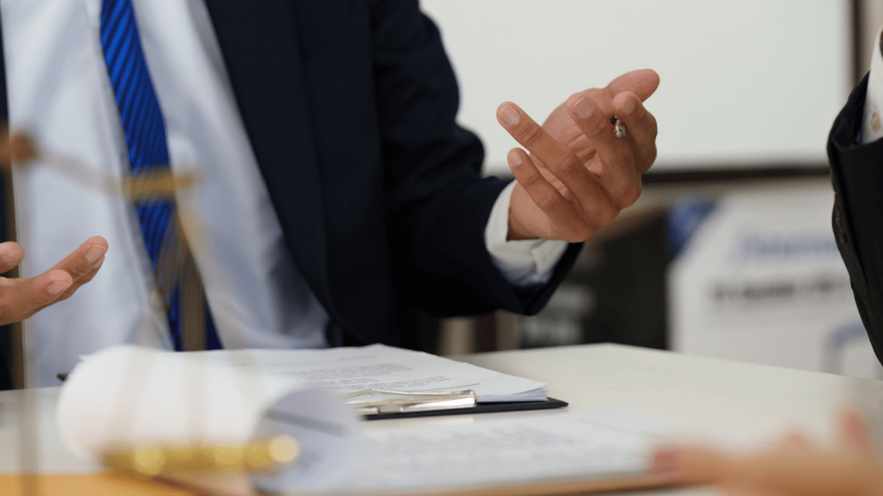 Professional truck crash lawyer consultation with client discussing legal documents and case strategy in law office