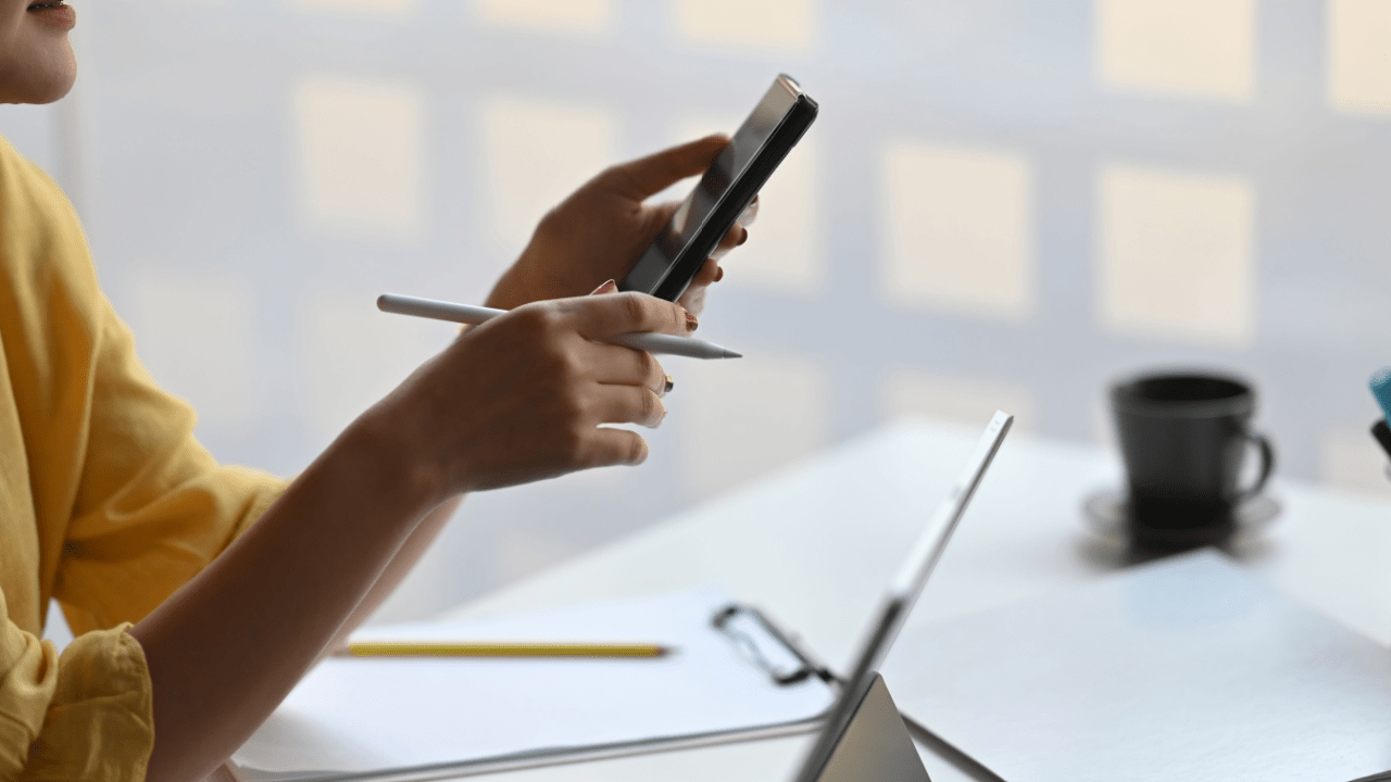 Mobile Research: Does Insurance Pay for Pain and Suffering - Person Investigating Claims on Smartphone