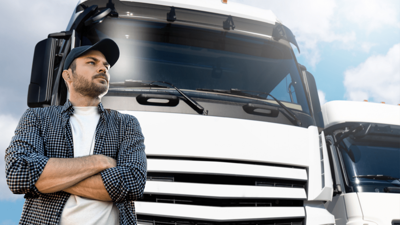 Professional truck driver standing confidently by commercial truck representing truck safety and restrictions