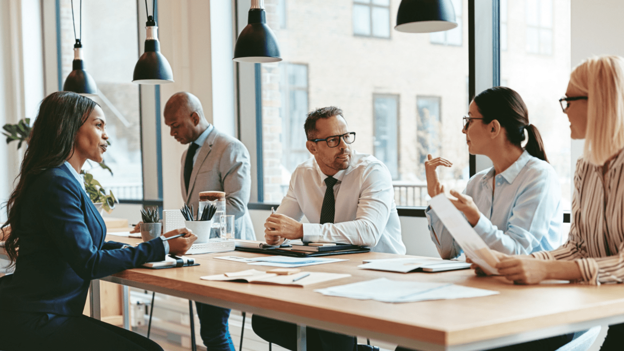 Professional attorneys discussing truck settlement timelines with clients during legal consultation meeting