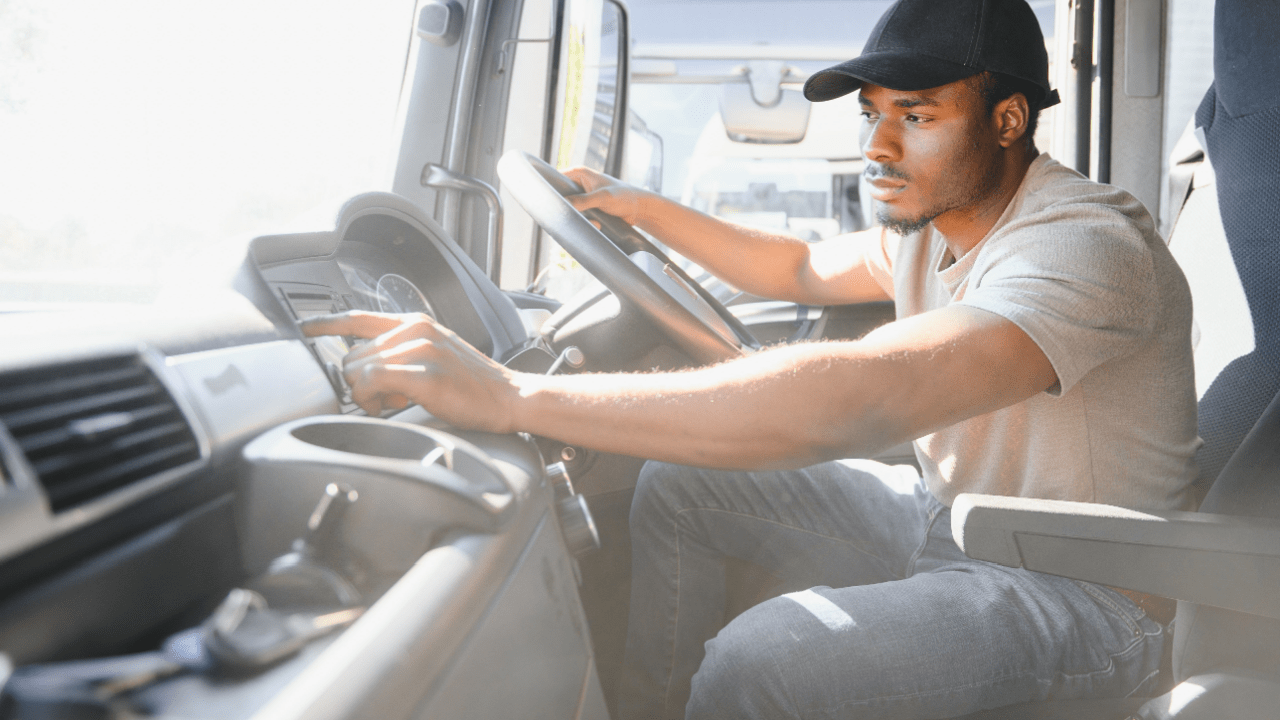 Truck driver at steering wheel learning what is a truck restriction for commercial vehicles