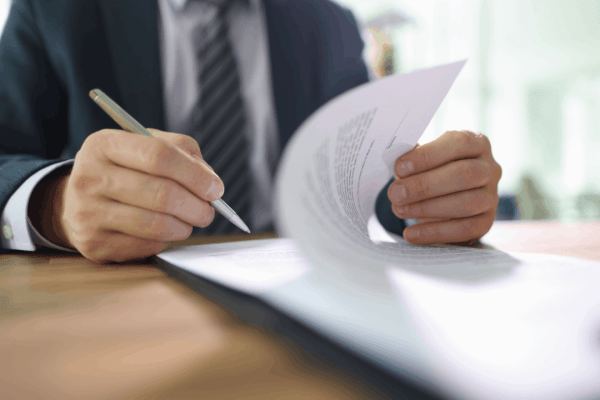 Attorney reviewing truck accident settlement documents showing how long insurers take to pay out settlements