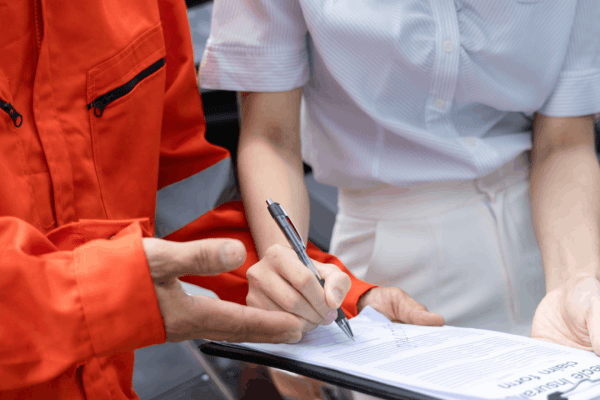 Truck accident victim reviewing settlement negotiation timeline documentation with attorney to understand how long truck accident negotiations usually take