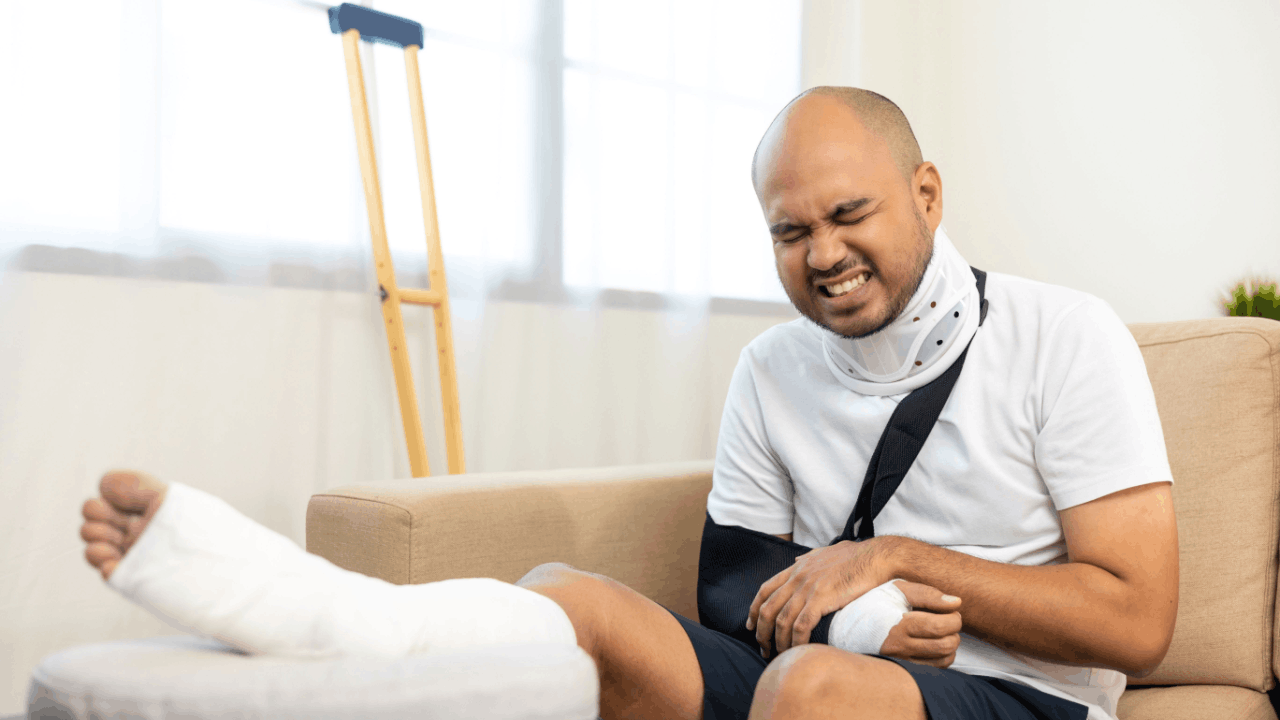 Man with neck brace and cast calculating pain and suffering compensation after a truck accident claim