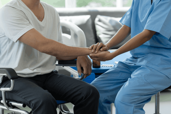 PTSD compensation in truck accident settlements shown through healthcare provider supporting patient during trauma recovery therapy