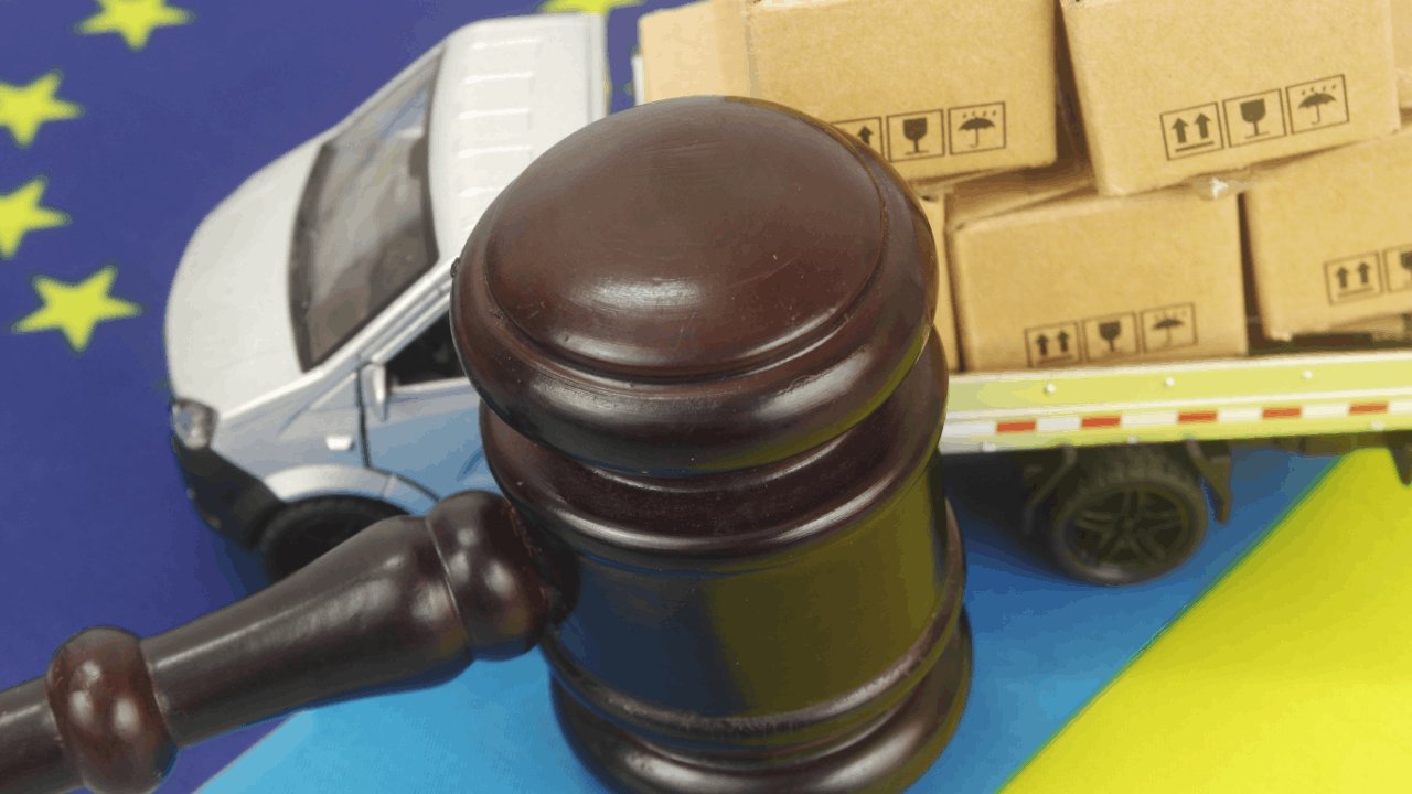 Tax rules for truck accident settlements illustrated by legal gavel with commercial delivery truck and cargo boxes