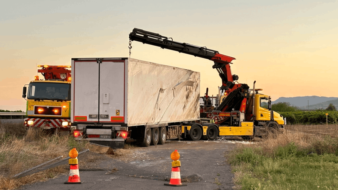 Overturned commercial truck being recovered after an accident, illustrating what happens when insurance accepts liability in a truck accident