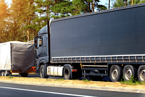 Commercial truck on highway illustrating what liability is in a truck accident claim