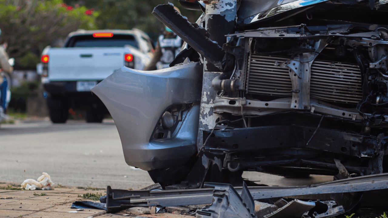 Semi-truck and car collision showing severe front-end vehicle damage