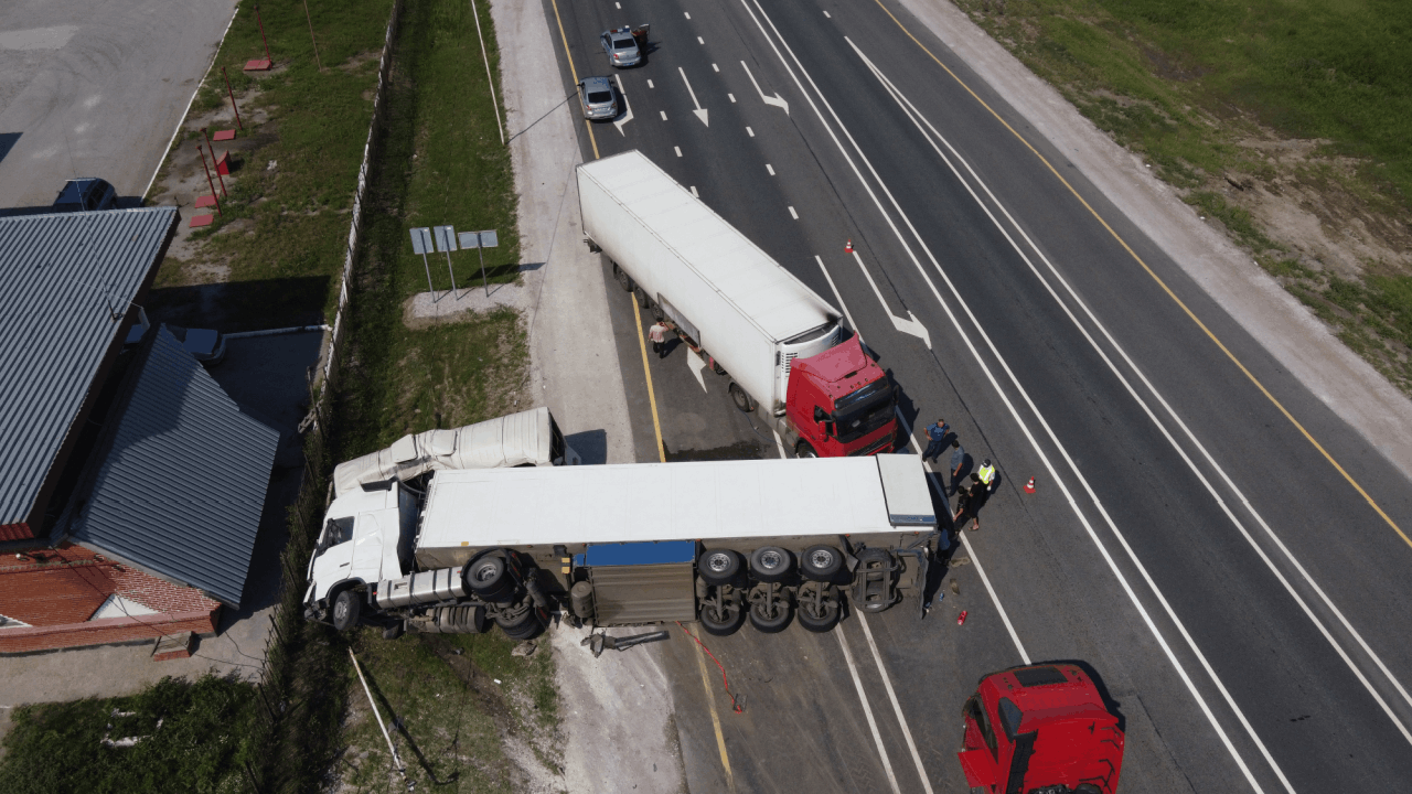 How many semi trucks crash a year — aerial view of semi truck accident on highway