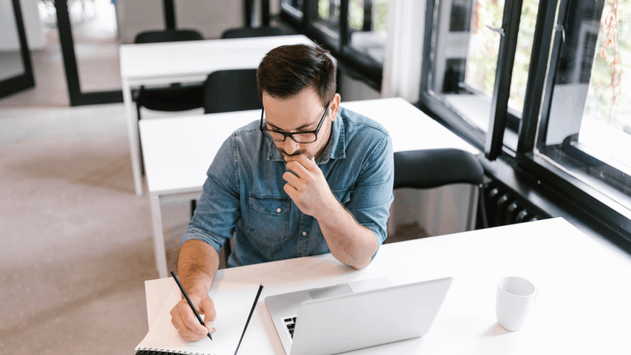 biggest cause of semi truck accidents man researching at desk