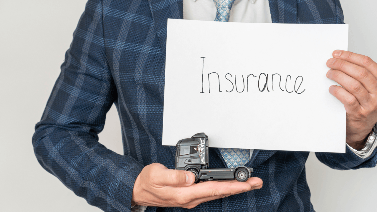 Truck accident insurance claims concept with toy truck and insurance sign