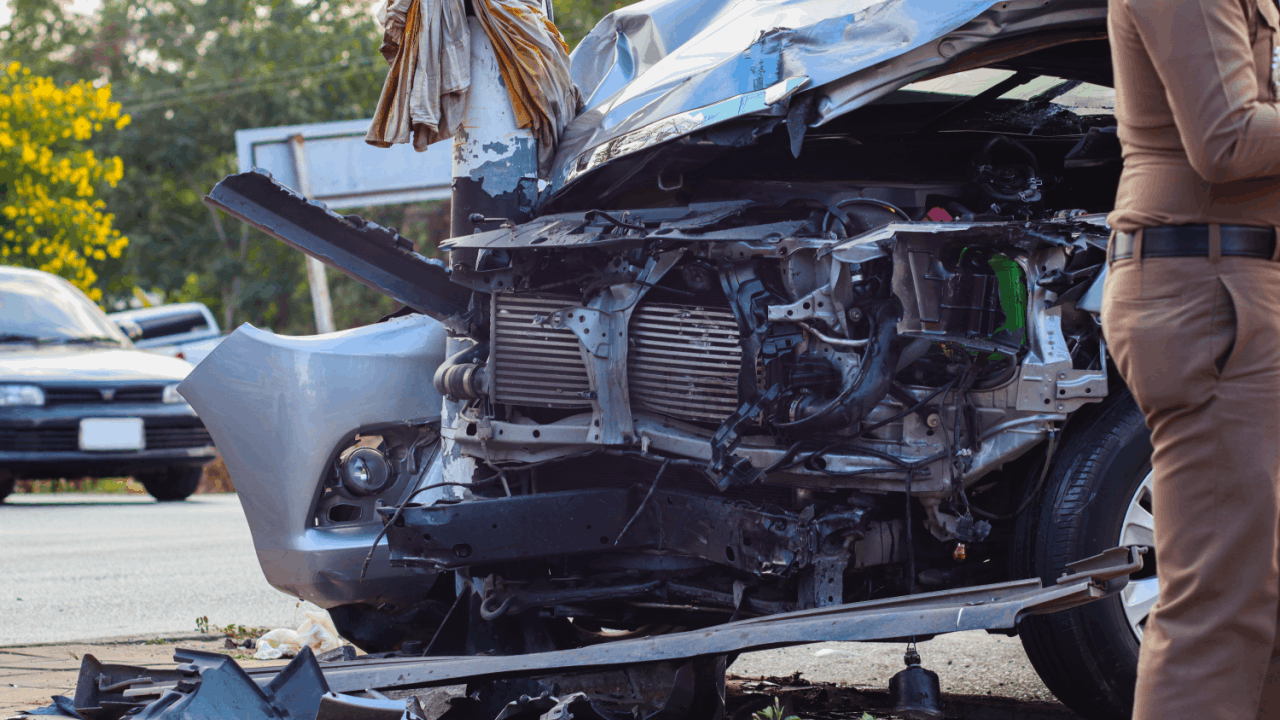 Crash caused by a driver with a revoked CDL showing severe front-end vehicle damage